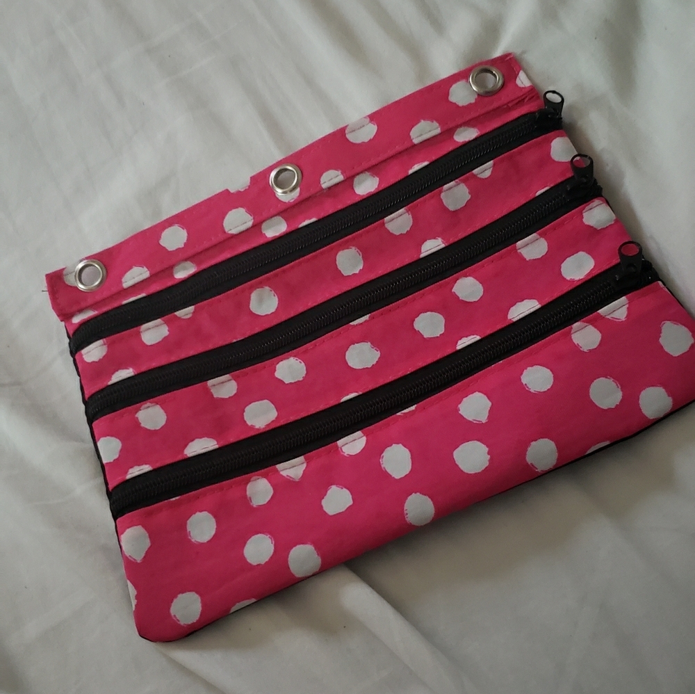 White dotted pink zipper case
